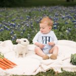 Photo of boy with bunny in flowers