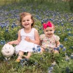 Photo of girls with bunny in flowers