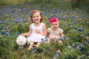 Photo of girls with bunny in flowers